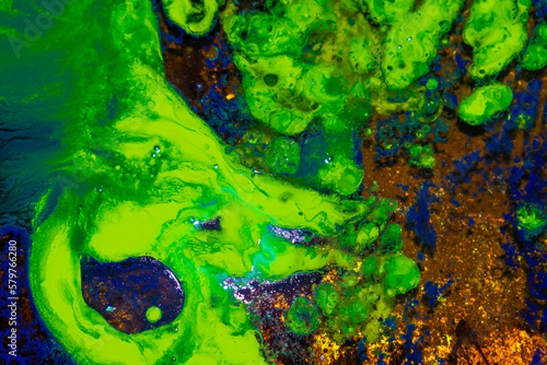 abstract background green, blue and gold oil paint liquid spills in waves, space for design and text