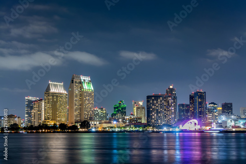 San Diego skyline at night with water colorful reflections, view from Coronado island, California