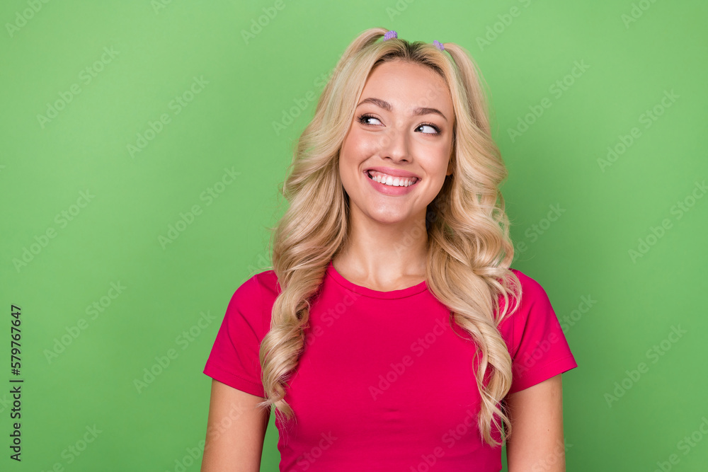 Photo of dreamy charming woman wear pink top looking empty space isolated green color background Photo of dreamy charming woman wear pink top looking empty space isolated green color background