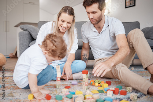 Learning, happy and family with building blocks on living room floor for child development skills. Mother, dad and young child on carpet with toys in family home for bonding, teaching and fun.