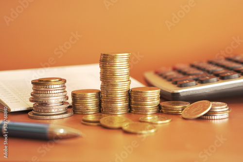 stacks of money coin with calculator, Business and financial investment concept