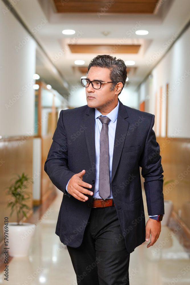 Indian businessman wearing suit and giving expression. Indian businessman wearing suit and giving expression.