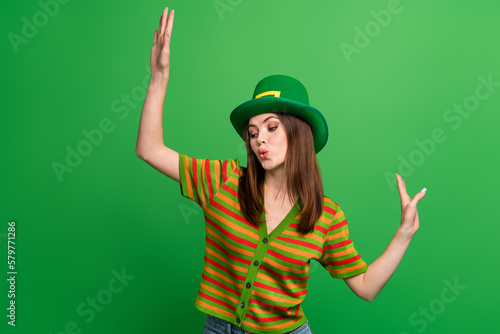 Photo of funky active young lady enjoy saint patrick festive event dance night club isolated on green color background