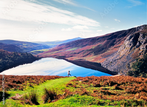 Wicklow Mountains, Ireland. Looking south over Lough Tay. Young woman in Aran sweater photo