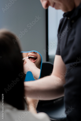 Dentistry doctor s consultation about teeth whitening color selection