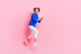 Full length photo of satisfied optimistic business worker hold smartphone chatting with her recruiter approve job isolated on pink color background