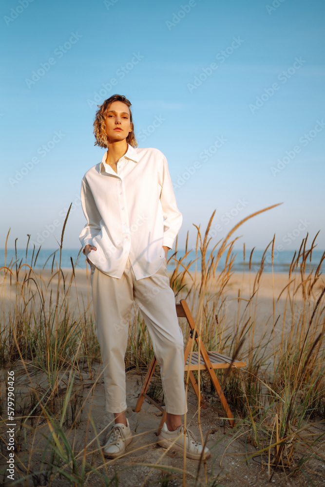 Young woman resting in nature. Fashion, style concept. Young woman resting in nature. Fashion, style concept.