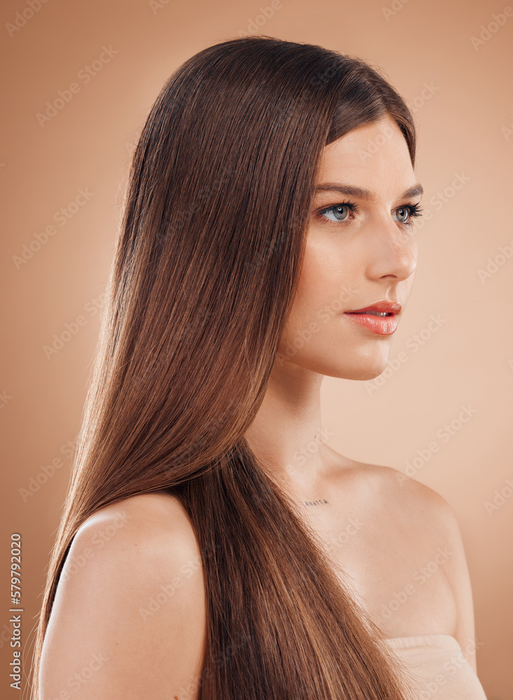 Fototapeta premium Woman, face or skincare glow and hair style, keratin treatment or dermatology healthcare on studio background. Beauty model, brunette color or facial makeup cosmetics in texture wellness or collagen