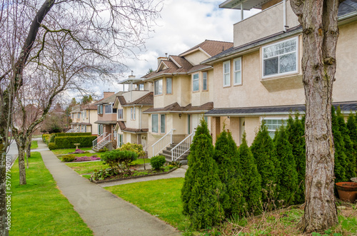 Houses in suburb with Spring Blossom in the north America. Luxury houses with nice white and pink coloured landscape.