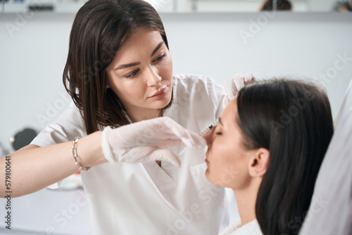 Wallpaper Mural Beautiful female on injection procedure for facial skin nutrition Torontodigital.ca