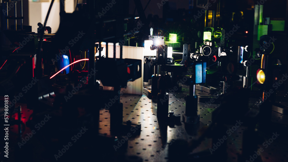 Experiment with laser device in optical laboratory. Experiment in optic lab with laser device. Experiment in optic lab with laser device. Experiment with laser device in optical laboratory. Experiment in optic lab with laser device. Experiment in optic lab with laser device.