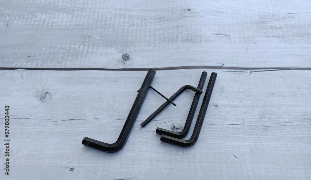 A set of allen, hex keys,Allen key or Hexagonal key also called inbus lock is a key used to