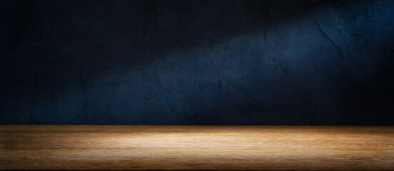 Wooden table or counter top with black stone wall background
