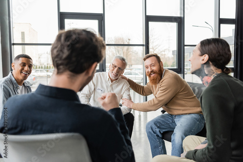 Canvastavla Cheerful interracial group of people with alcohol addiction talking in rehab center