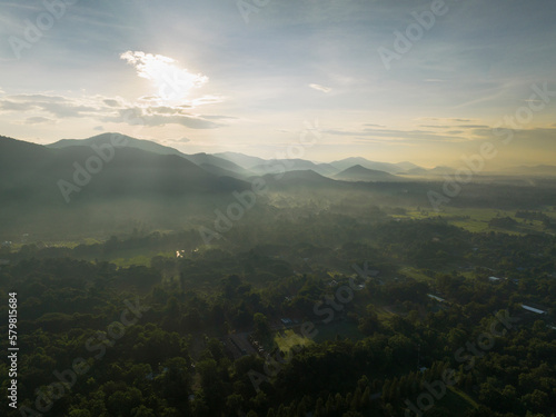 Aerial view of hills, green fields and forest at sunrise, Chiang Mai, Chiang Mai province of northern Thailand. photo