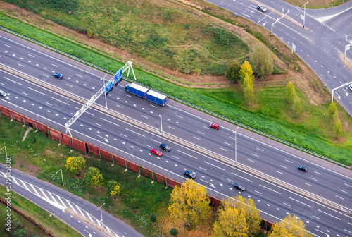 Aerial view of motorway A28 with cars, truck and noise barrier, Amersfoort, province of Utrecht, The Netherlands. photo