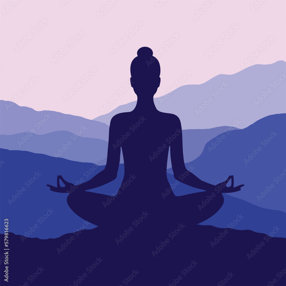 Silhouette of a woman meditating in the mountains in twilight.	