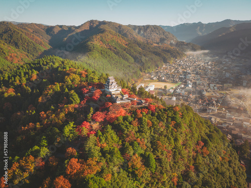 Aerial view of Gujo Hachiman Castle at sunrise during koyo season, Gujo, Gifu, Japan. photo