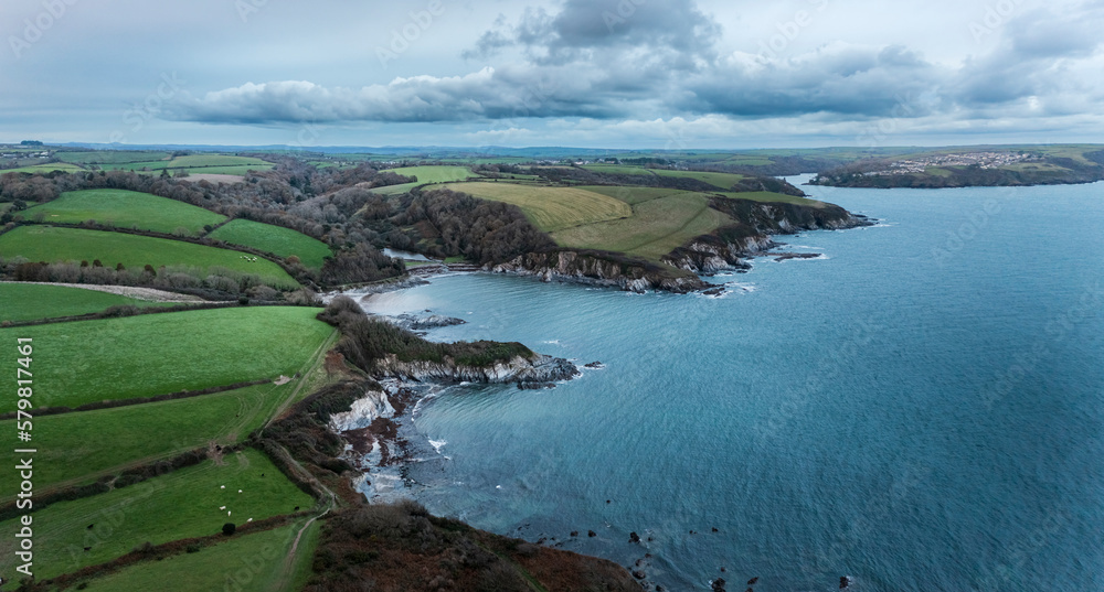 Aerial View of Polridmouth Beach looking towards Fowey in winter, Cornwall, United Kingdom. Aerial View of Polridmouth Beach looking towards Fowey in winter, Cornwall, United Kingdom.