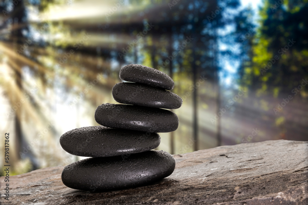 Massage stones on stone background in forest Massage stones on stone background in forest