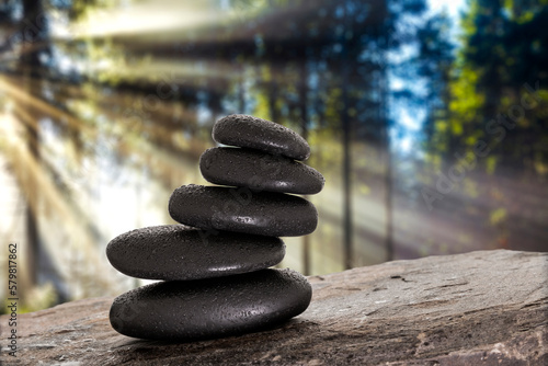 Massage stones on stone background in forest