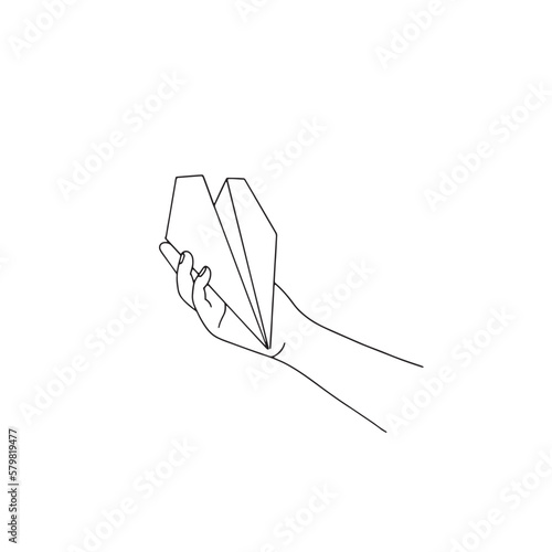 Hand holding a paper airplane. International Civil Aviation Day. Isolated on white background