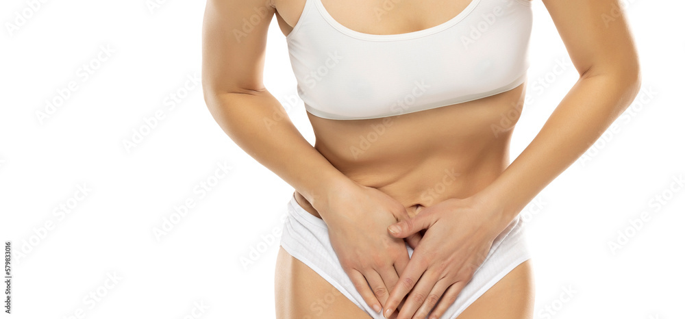 Gynecology concept. Young woman suffering from pain, white background Gynecology concept. Young woman suffering from pain, white background