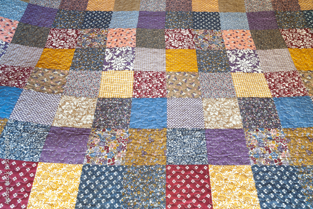 Print in patchwork style. Patchwork print quilt. Geometric pattern. Selective focus Print in patchwork style. Patchwork print quilt. Geometric pattern. Selective focus
