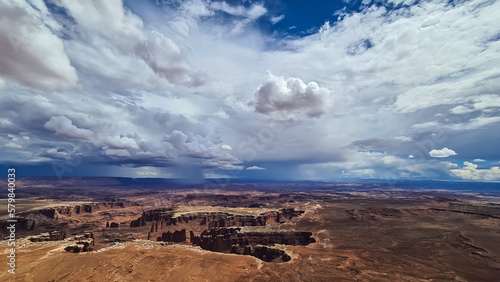 Scenic view on Split Mountain Canyon seen from Grand View Point Overlook near Moab  Island in the Sky District  Canyonlands National Park  San Juan County  Utah  USA. Dark clouds accumulating to storm
