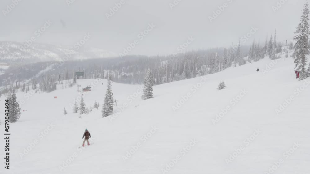snowboarder on slope wide mountain scenery snowboarder on slope wide mountain scenery