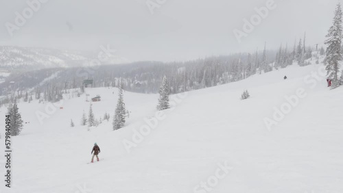snowboarder on slope wide mountain scenery