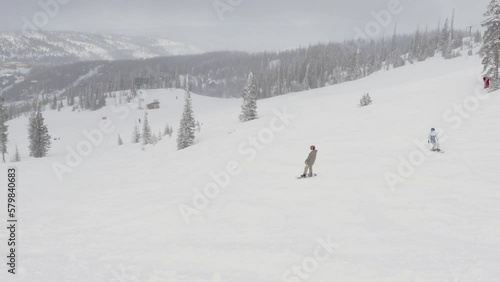 snowboarder on slope wide mountain scenery