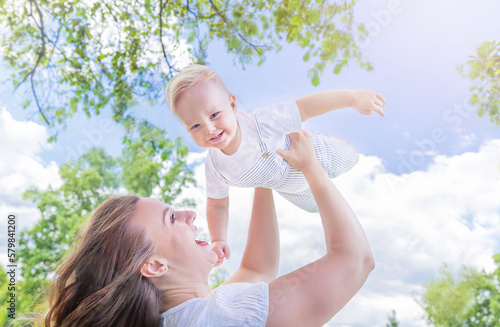 Healthy child  kid  having fun with mother in the sunny summer day at the park. Caucasians happy baby  boy . Healthy lifestyle  happy childhood  Mother s Day concept..