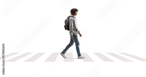 African american male student walking across a street