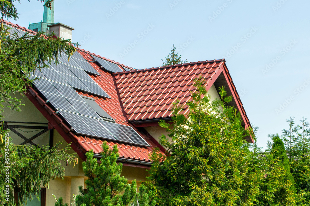 Historic farm house with modern solar panels on roof and wall High quality photo - obrazy, fototapety, plakaty 