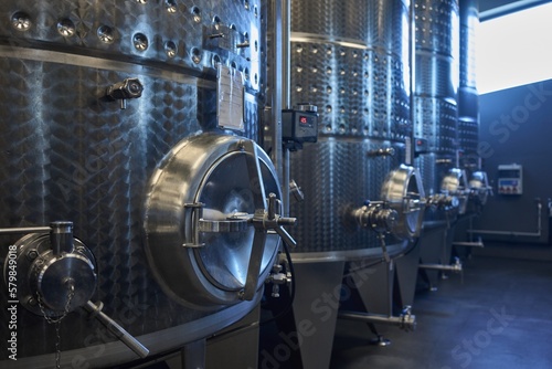 Industrial environment . huge metal tanks used for reductive wine making in vine cellar of modern winery. photo