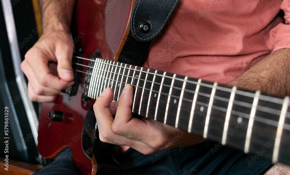 Fototapeta premium young musician plays guitar