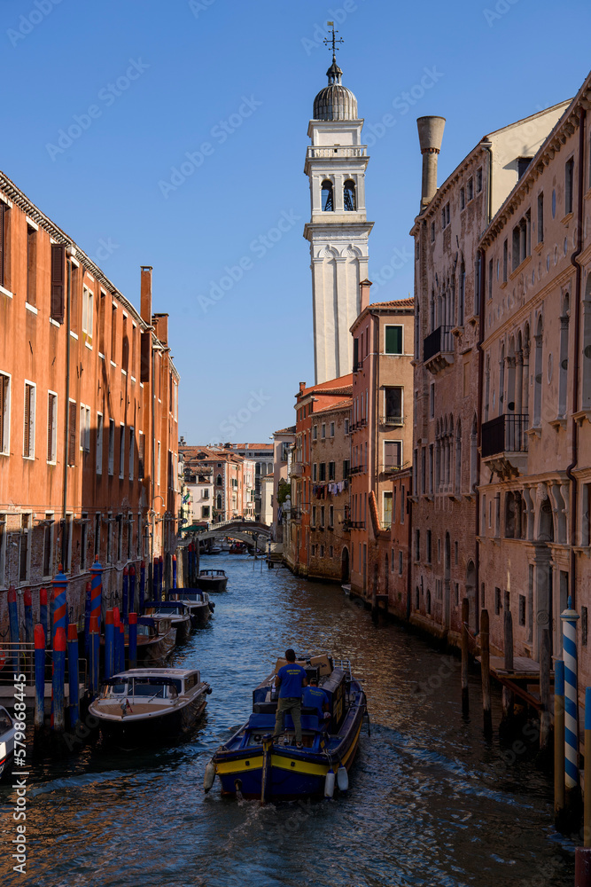 Venice, Italy - Boat on canal and Church of Saint George of the Greeks