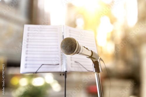 Foto Religious songs with microphone and music stand in church
