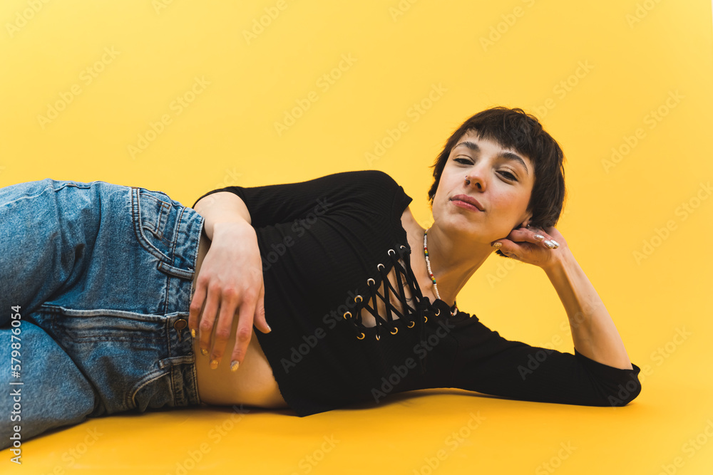 Medium shot of a woman lying down on her side with an enigmatic expression on her face and eyes partially closed. High quality photo Medium shot of a woman lying down on her side with an enigmatic expression on her face and eyes partially closed. High quality photo