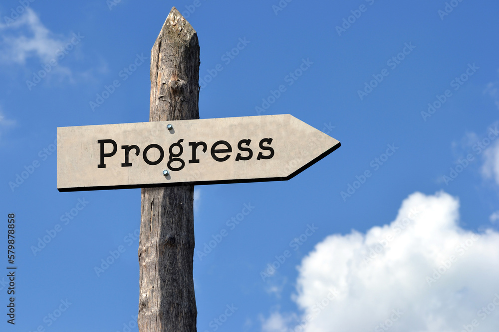 Progress - wooden signpost with one arrow, sky with clouds Progress - wooden signpost with one arrow, sky with clouds