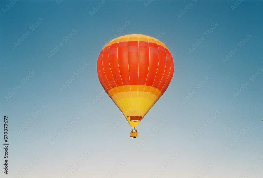 Naklejka premium hot air balloon in flight on film