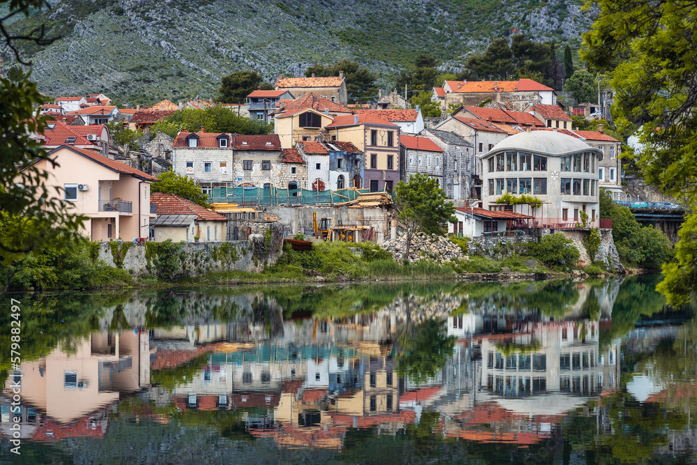 Old historic picturesque town of Trebinje with reflections in the river