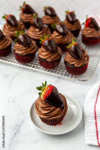 Chocolate Cupcake with Chocolate Frosting Topped with a Chocolate-Dipped Strawberry