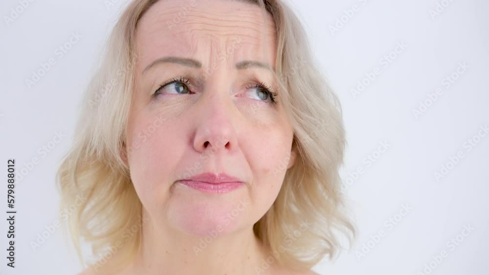 hide tears woman cries sadly looks cry without tears sighs lowers eyes shrugs shoulders trouble frustration disappointment sadness whims blonde on a white background hide tears woman cries sadly looks cry without tears sighs lowers eyes shrugs shoulders trouble frustration disappointment sadness whims blonde on a white background