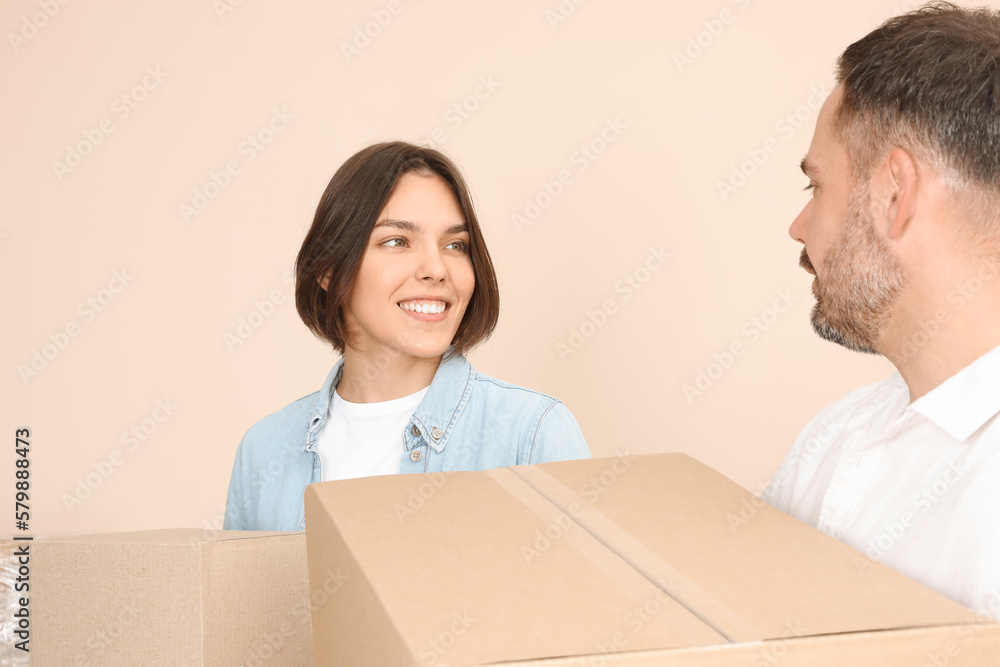 Happy couple with moving boxes in new apartment Happy couple with moving boxes in new apartment