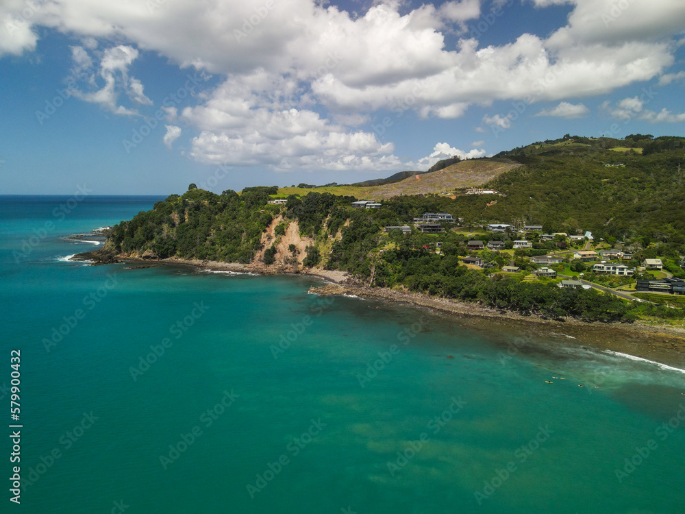 Surf break at Hot Water Beach along the Coromandel Peninsula in New Zealand. Aerial drone view of waves.