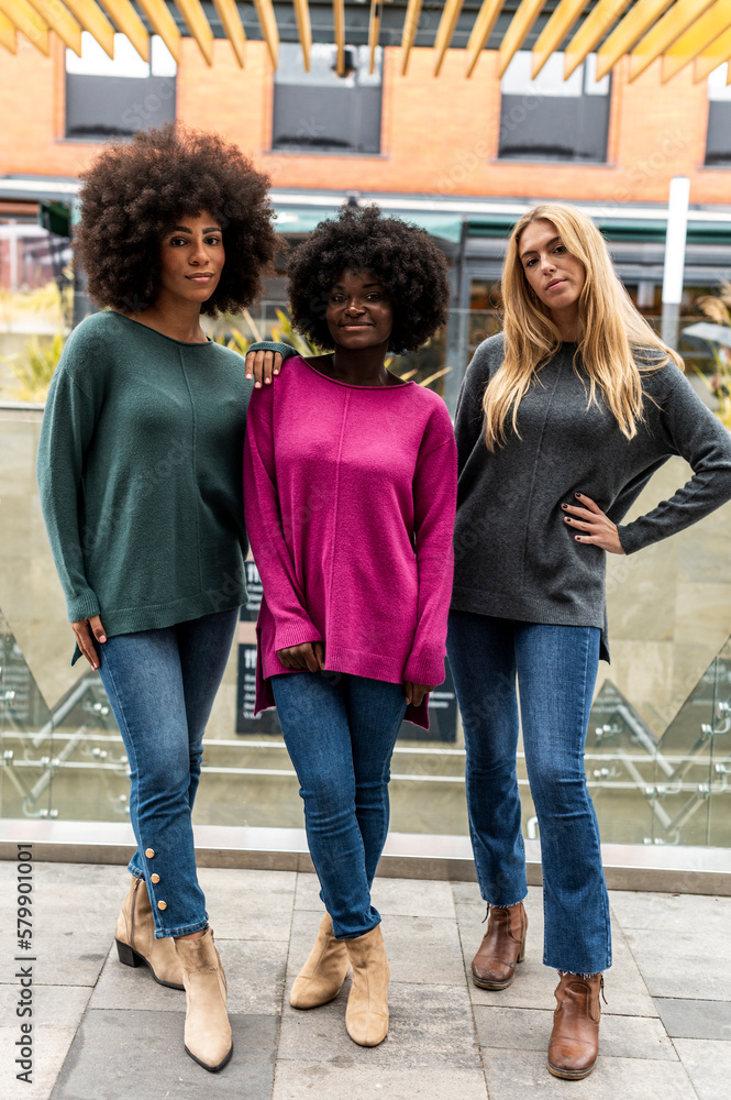 Multiracial women sharing free time in coworking space Multiracial women sharing free time in coworking space
