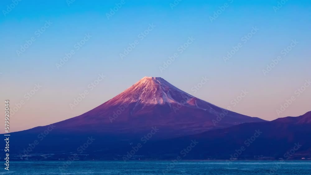 A sunset timelapse of Mt.Fuji near Suruga coast in Shizuoka wide shot panning A sunset timelapse of Mt.Fuji near Suruga coast in Shizuoka wide shot panning