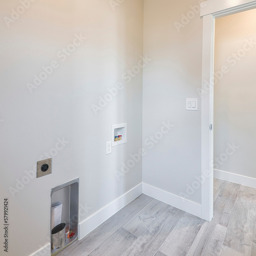 Square Empty laundry room with light beige interior and white wooden tiles
